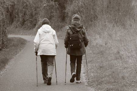 two women walking a trail