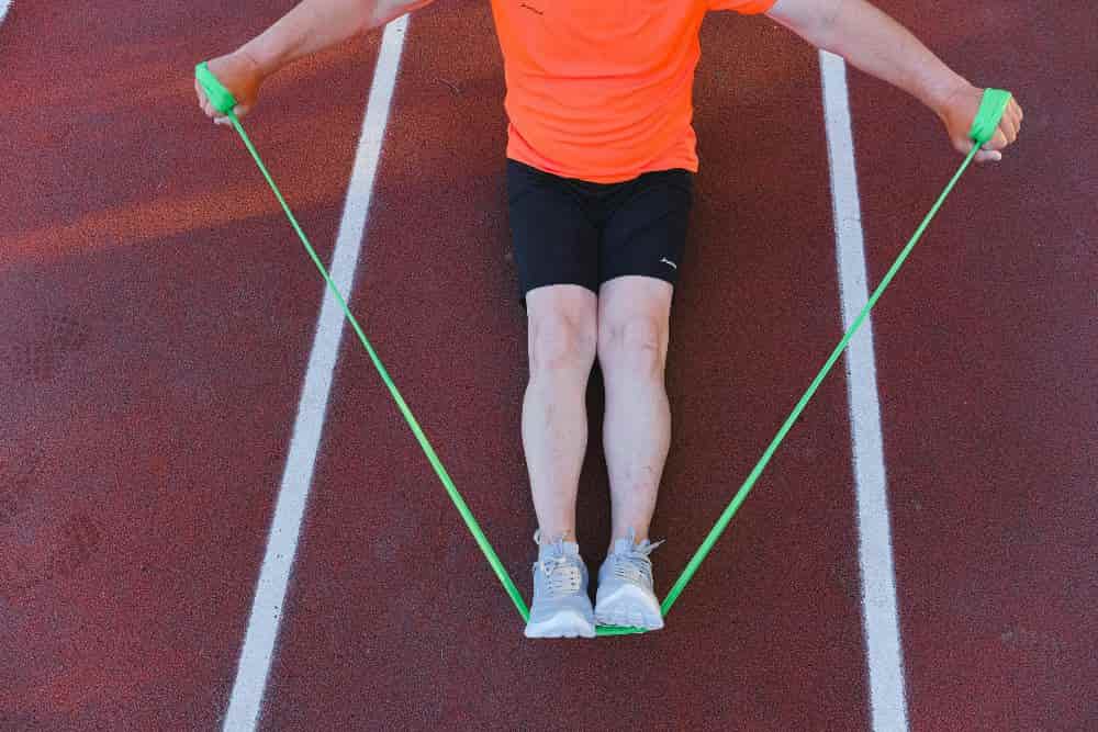 man using resistance bands